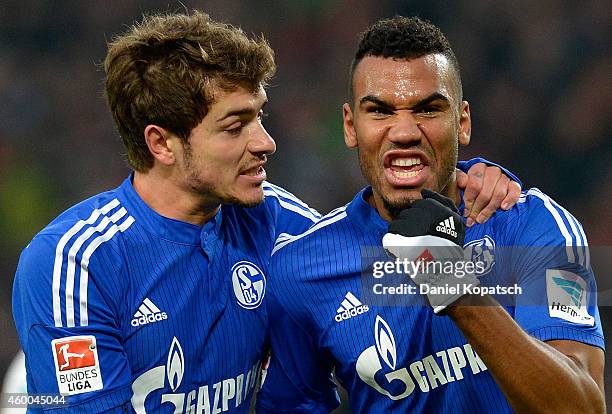 Eric Maxim Choupo-Moting of Schalke celebrates his team's third goal with team mate Roman Neustaedter during the first Bundesliga match between VfB...