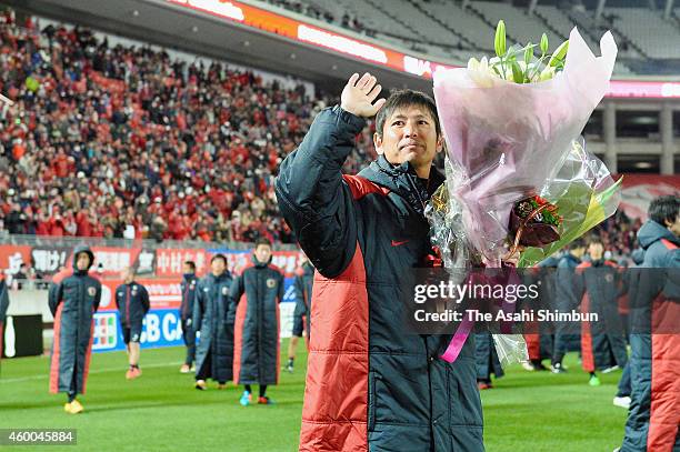 Koji Nakata of Kashima Antlers waves to supporters as he retires after the J.League match between Kashima Antlers and Sagan Tosu at Kashima Soccer...