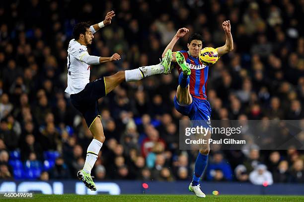 Nabil Bentaleb of Spurs battles for the ball with Martin Kelly of Crystal Palace during the Barclays Premier League match between Tottenham Hotspur...