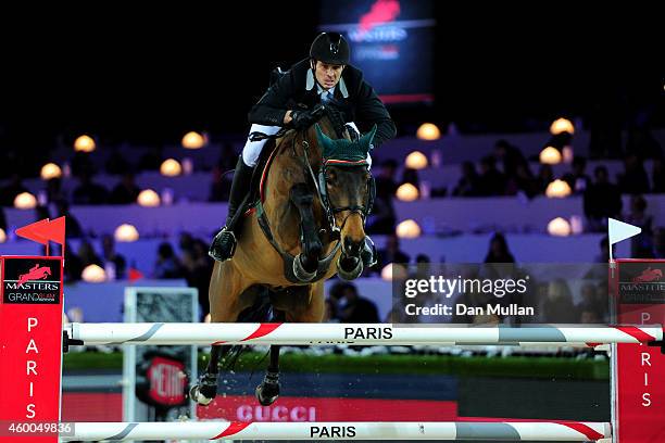 1st place finisher Steve Guerdat from Switzerland rides Albfuehren's Memphis at Le Figaro Prize as part of the Gucci Paris Masters 2014 on December...