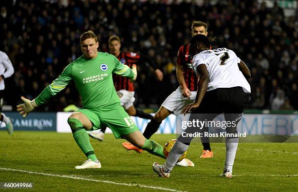 Simon Dawkins of Derby is challenged by David Stockdale of Brighton during the Sky Bet Championship match between Derby County and Brighton & Hove...