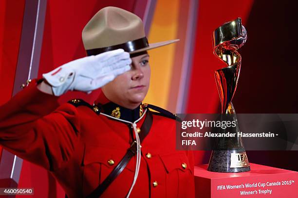 The FIFA Woman`s World Cup Trophy is carried by a Officers of the Royal Canadian Mounted Police during the Final Draw for the FIFA Women's World Cup...