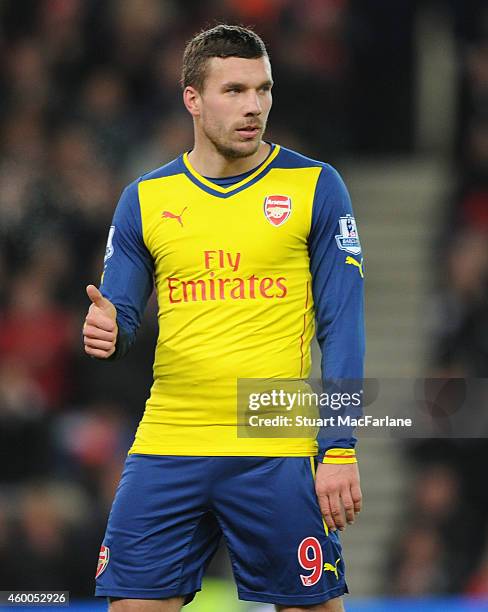 Lukas Podolski of Arsenal during the Barclays Premier League match between Stoke City and Arsenal at the Britannia Stadium on December 6, 2014 in...