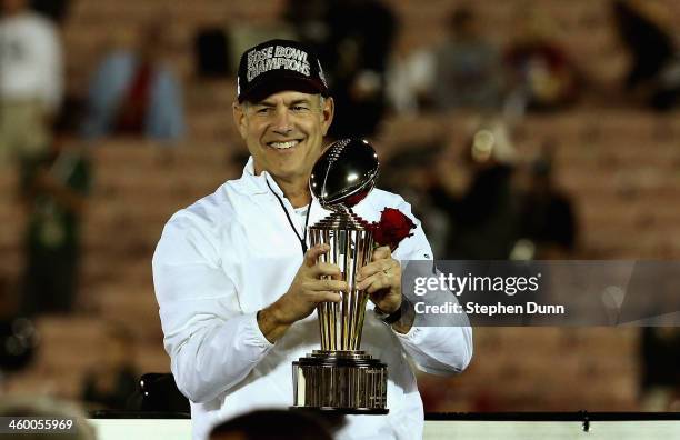 Michigan State Spartans head coach Mark Dantonio celebrates with the Rose Bowl Game trophy after defeating the Stanford Cardinal 24-20 in the 100th...