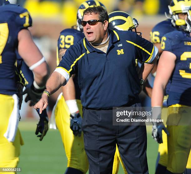 Head coach Brady Hoke of the Michigan Wolverines shouts instructions from the sideline during a game against the Ohio State Buckeyes at Michigan...