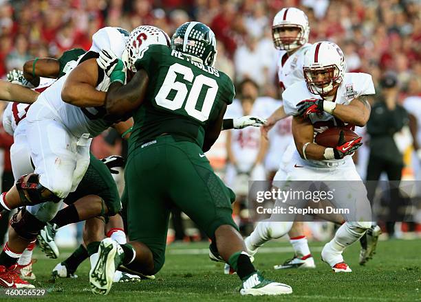 Running back Tyler Gaffney of the Stanford Cardinal runs the ball in the second half against the Michigan State Spartans during the 100th Rose Bowl...