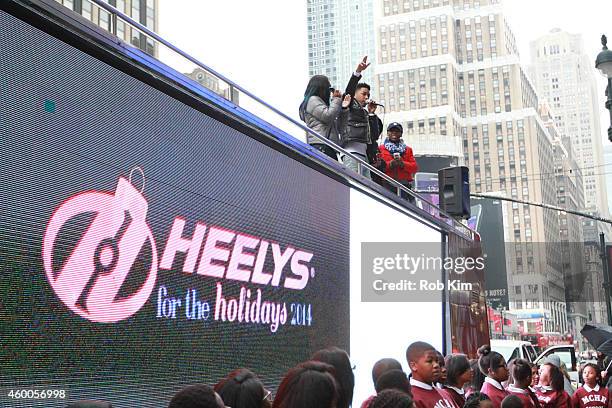 Jacob Latimore performs on top of a bus at HEELYS For The Holidays Charity Event at Madison Square Garden on December 6, 2014 in New York City.