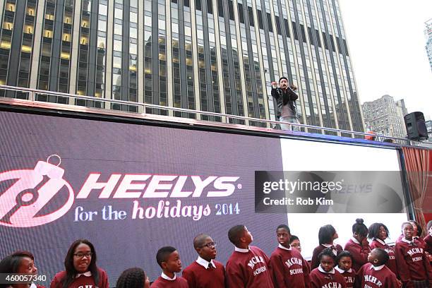 Jacob Latimore performs on top of a bus at HEELYS For The Holidays Charity Event at Madison Square Garden on December 6, 2014 in New York City.