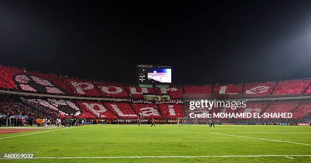 Fans of the Egypt's Al-Ahly display a message which reads "for fun" ahead of the second leg of the CAF Confederation Cup final football match between...