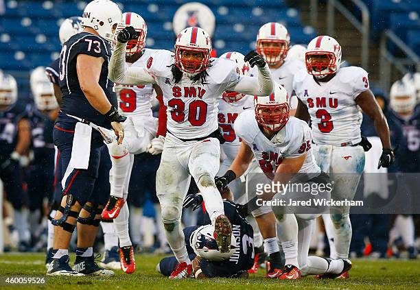 Robert Seals of the SMU Mustangs celebrates a defensive stop in the second half against the Connecticut Huskies during the game at Rentschler Field...