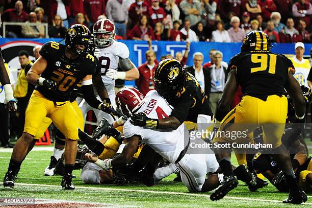 Yeldon of the Alabama Crimson Tide scores a touchdown against the defense of Markus Golden of the Missouri Tigers in the second quarter of the SEC...