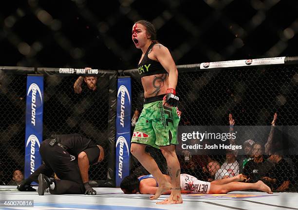 Raquel Pennington reacts to her victory over Ashlee Evans-Smith in their women's bantamweight bout during the UFC 181 event inside the Mandalay Bay...