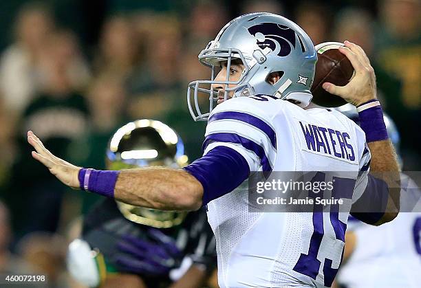 Jake Waters of the Kansas State Wildcats passes against the Baylor Bears during the first half of the game on December 6, 2014 at McLane Stadium in...