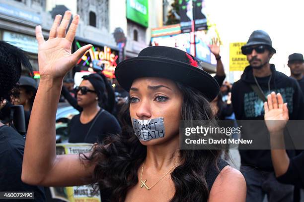 Actress Logan Browning marches on Hollywood Boulevard in protest of the decision in New York not to indict a police officer involved in the...