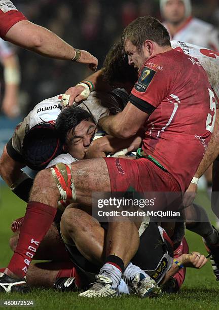 Nick Williams of Ulster is tackled by Johan Snyman of Scarlets during the European Rugby Champions Cup match between Ulster Rugby and Scarlets at the...