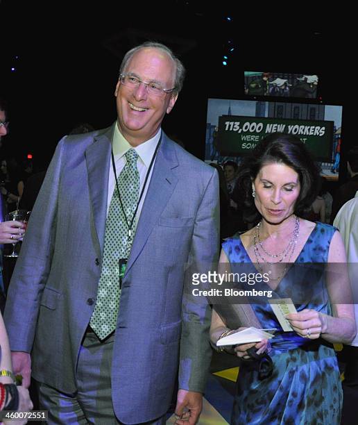 Laurence "Larry" Fink, chairman and chief executive officer of BlackRock Inc., and his wife Lori Fink, attend the annual Robin Hood Foundation...