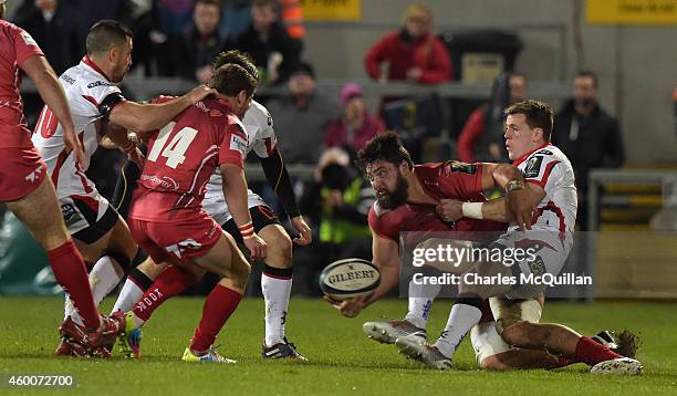 Craig Gilroy of Ulster tackles Rory Pitman of Scarlets during the European Rugby Champions Cup match between Ulster Rugby and Scarlets at the...