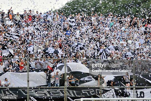 Fans of libertad cheer for their team during a match between Nacional and Libertad as part of round 22 of Torneo Clausura 2014 at Manuel Ferreira...