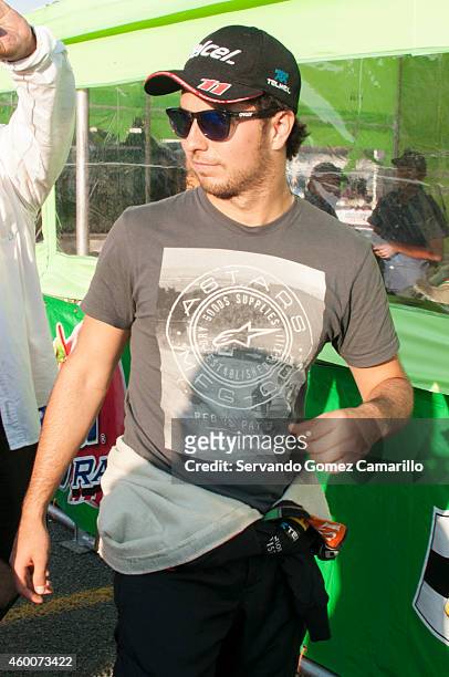 Mexican driver of Formula one Sergio "Checo" Pérez signs autographs prior a race in the Grand Prix International Wings Army kart at Omnilife Stadium...