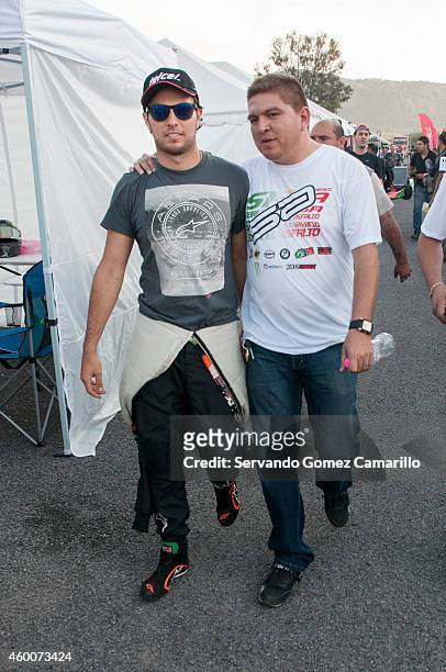 Mexican driver of Formula one Sergio "Checo" Pérez walks prior a race in the Grand Prix International Wings Army kart at Omnilife Stadium on December...