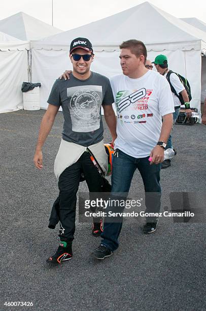 Mexican driver of Formula one Sergio "Checo" Pérez walks prior a race in the Grand Prix International Wings Army kart at Omnilife Stadium on December...