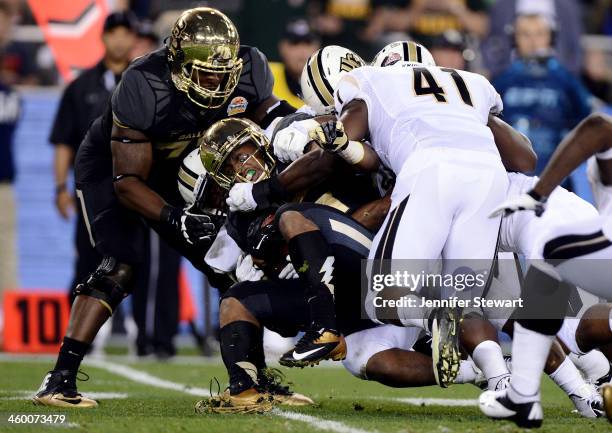 Running back Lache Seastrunk of the Baylor Bears carries the ball against the UCF Knights in the first quarter of the Tostitos Fiesta Bowl at...