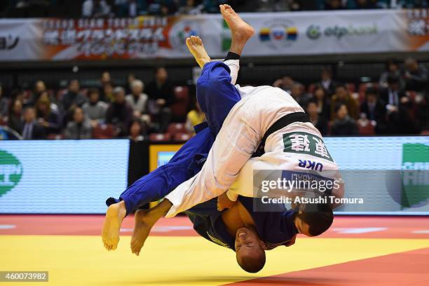 Quedjau Nhabali of Ukraine and Kamil Kozlowski of Poland compete in Men's -90kg during Judo Grand Slam Tokyo 2014 at Tokyo Metropolitan Gymnasium on...