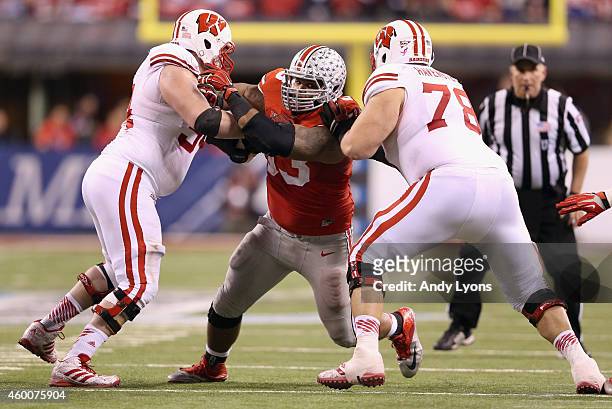 Defensive lineman Michael Bennett plays while wearing to honor late teammate Kosta Karageorge of the Ohio State Buckeyes during the Big Ten...