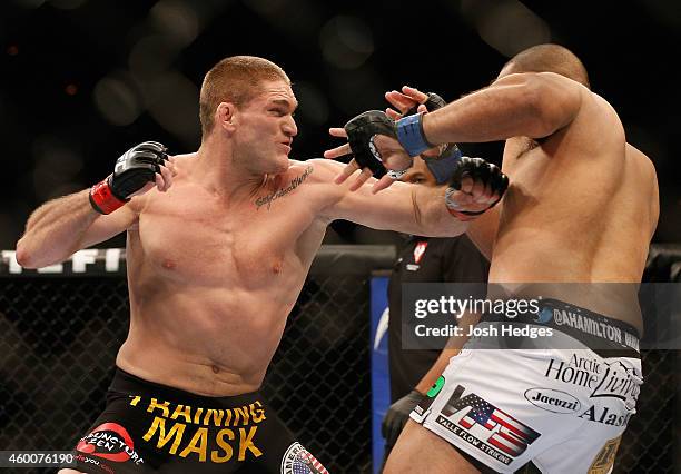 Todd Duffee punches Anthony Hamilton in their heavyweight bout during the UFC 181 event inside the Mandalay Bay Events Center on December 6, 2014 in...