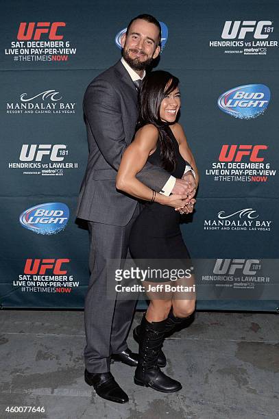 Phil 'CM Punk' Brooks poses with wife AJ Lee backstage during the UFC 181 event inside the Mandalay Bay Events Center on December 6, 2014 in Las...