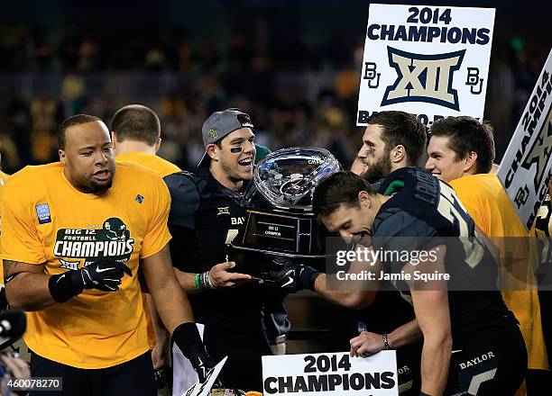 Bryce Petty of the Baylor Bears holds the Big 12 Championship trophy following their victory over Kansas State Wildcats on December 6, 2014 at McLane...