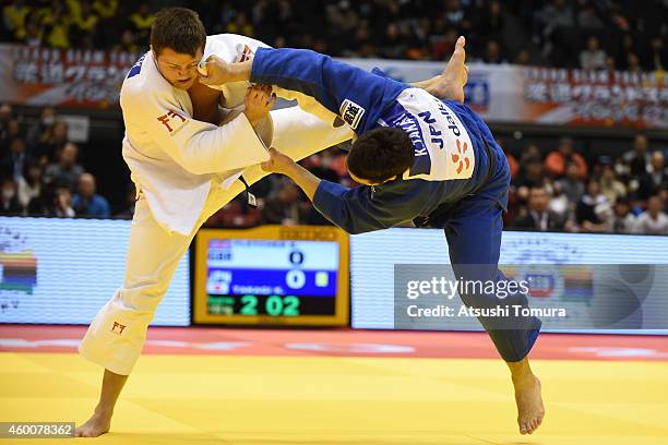 Kaihan Takagi of Japan and Benjamin Fletcher of Great Britain compete in Men's -100kg during Judo Grand Slam Tokyo 2014 at Tokyo Metropolitan...