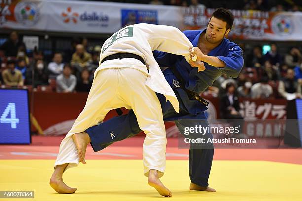 Kaihan Takagi of Japan and Benjamin Fletcher of Great Britain compete in Men's -100kg during Judo Grand Slam Tokyo 2014 at Tokyo Metropolitan...