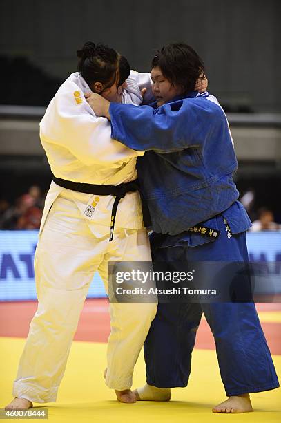 Iryna Kindzerska of Ukraine and Sarah Asahina of Japan compete in Women's +78kg during Judo Grand Slam Tokyo 2014 at Tokyo Metropolitan Gymnasium on...