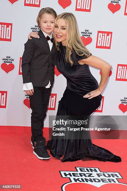 Xenia Seeberg and her son Philias Martinek attend the Ein Herz Fuer Kinder Gala 2014 at Tempelhof Airport on December 6, 2014 in Berlin, Germany.