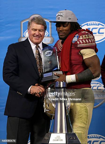 Dalvin Cook of the Florida State Seminoles recieves the MVP trophy after their 37-35 victory over the Georgia Tech Yellow Jackets at the ACC...