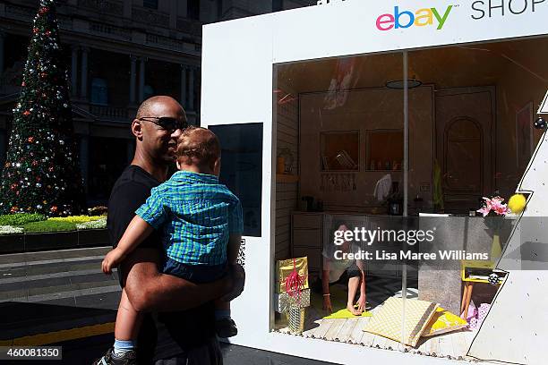 Woman is seen inside a pop-up Ebay display store at Circular Quay during the Christmas shopping period on December 7, 2014 in Sydney, Australia.