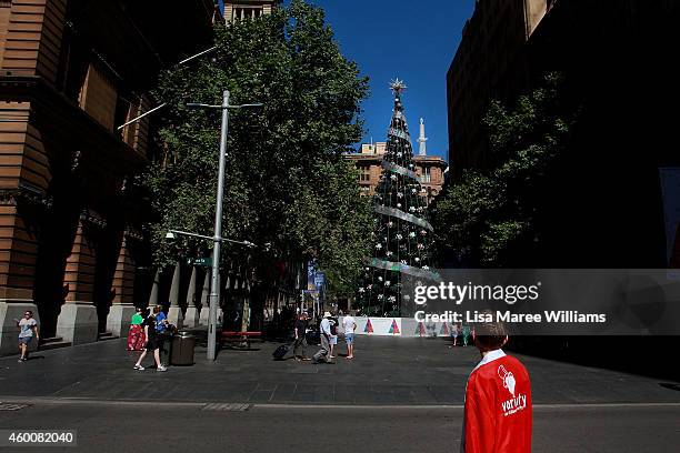 Young boy stops to look at a giant Christmas Tree in Martin Place during the Christmas shopping period on December 7, 2014 in Sydney, Australia.