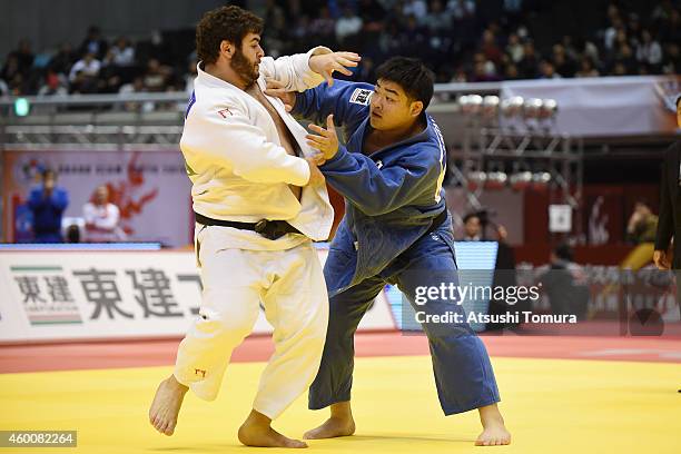 Levani Matiashvili of Georgia and Takeshi Ojitani of Japan compete in Men's +100kg semi final during Judo Grand Slam Tokyo 2014 at Tokyo Metropolitan...