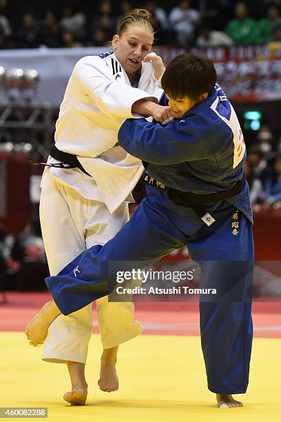 Anamari Velensek of Slovenia and Ruika Sato of Japan compete in Women's -78kg semi final during Judo Grand Slam Tokyo 2014 at Tokyo Metropolitan...