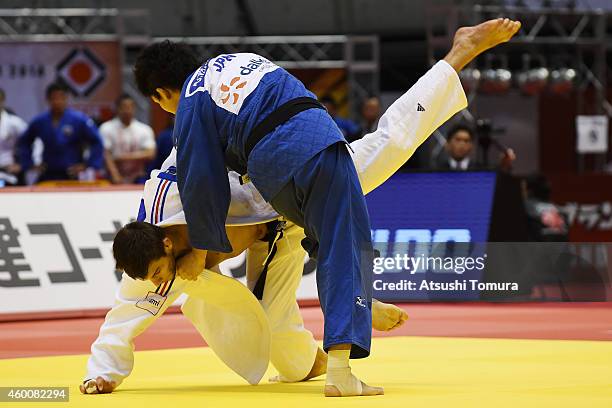 Alexandre Iddir of France and Daiki Nishiyama of Japan compete in Men's -90kg semi final during Judo Grand Slam Tokyo 2014 at Tokyo Metropolitan...