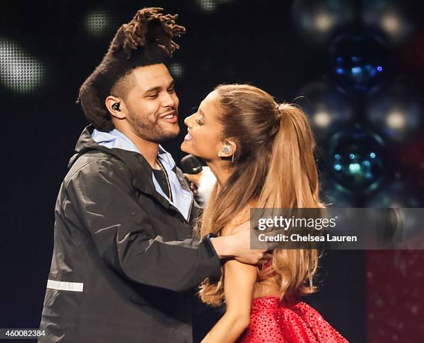 Recording artist The Weeknd and singer Ariana Grande perform at KIIS FM's Jingle Ball at Staples Center on December 5, 2014 in Los Angeles,...