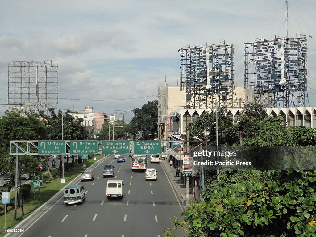 Billboards along Quezon Avenue as seen from an overpass near...