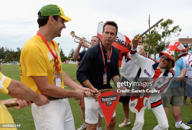 Former England captain Michael Vaughan referees a tug of war between England and Australian cricket fans during the Yorkshire Tea Beach Party at...