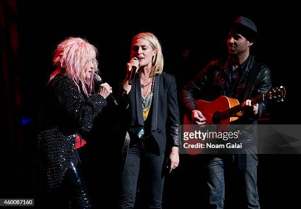 Cyndi Lauper, Emily Haines and James Shaw perform during the 4th Annual "Home For The Holidays" Benefit Concert at Beacon Theatre on December 6, 2014...