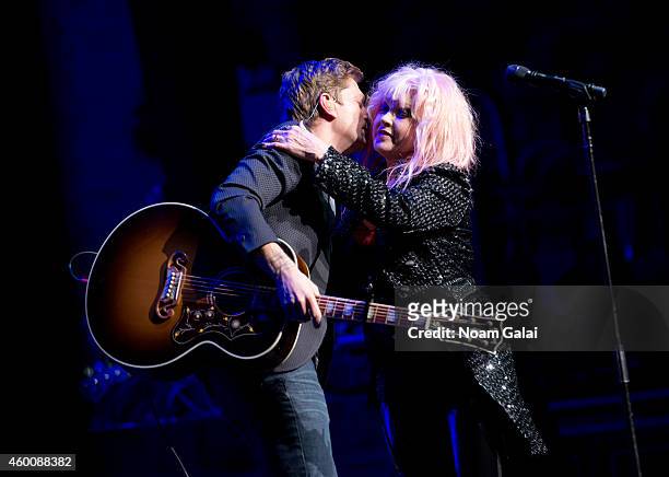Rob Thomas and Cyndi Lauper perform during the 4th Annual "Home For The Holidays" Benefit Concert at Beacon Theatre on December 6, 2014 in New York...