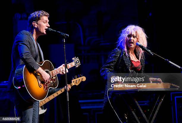 Rob Thomas and Cyndi Lauper perform during the 4th Annual "Home For The Holidays" Benefit Concert at Beacon Theatre on December 6, 2014 in New York...