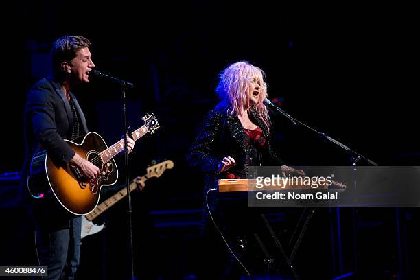 Rob Thomas and Cyndi Lauper perform during the 4th Annual "Home For The Holidays" Benefit Concert at Beacon Theatre on December 6, 2014 in New York...