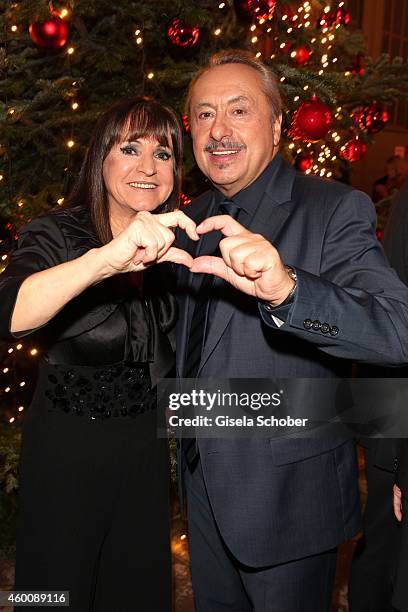 Christine Stumph and Wolfgang Stumph arrive at the Ein Herz fuer Kinder Gala 2014 at Tempelhof Airport on December 6, 2014 in Berlin, Germany.