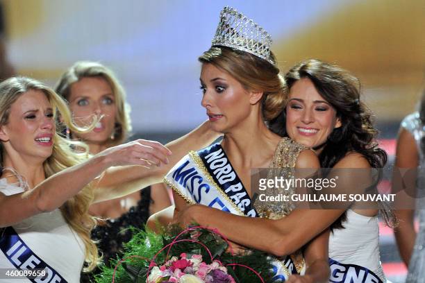 Miss Nord-Pas-de-Calais Camille Cerf is congratulated by Miss Ile de France 2014 Margaux Savarit and Miss Auvergne 2014 Morgane Laporte after Cerf...
